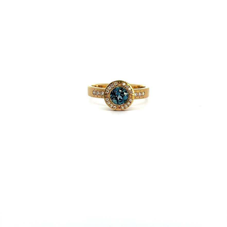 18 karat Yellow Gold, Montana Sapphire and Diamond Halo Ring