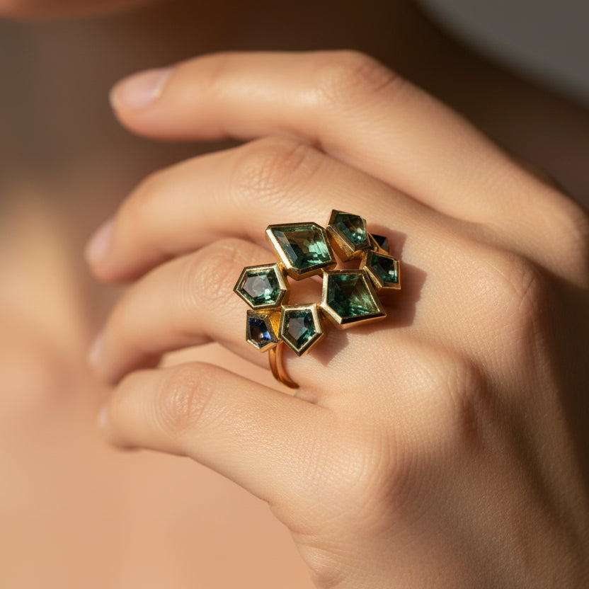 Geometric colored ring on women hand in 18K yellow gold