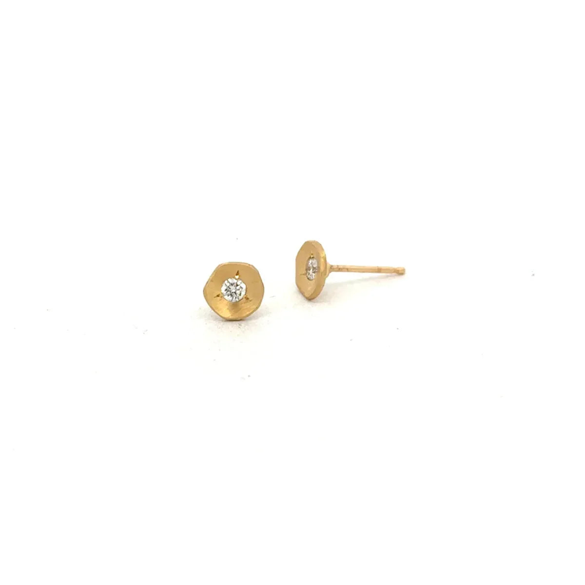 The Ali Dumont Everyday Diamond Stud Earrings feature small hexagonal 18k yellow gold fronts, each set with a central round diamond, elegantly displayed on a white background.
