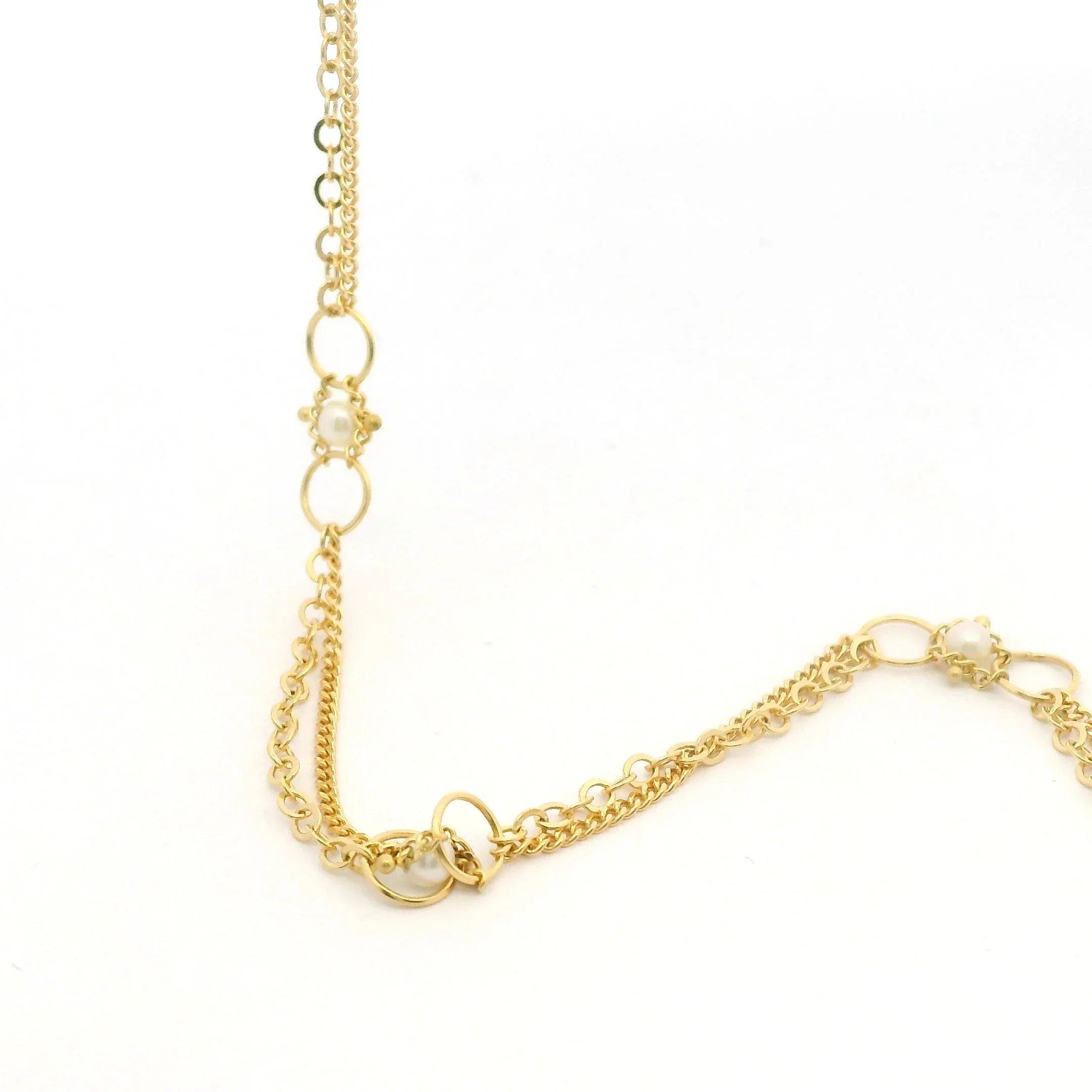 Yellow gold and pearl station necklace