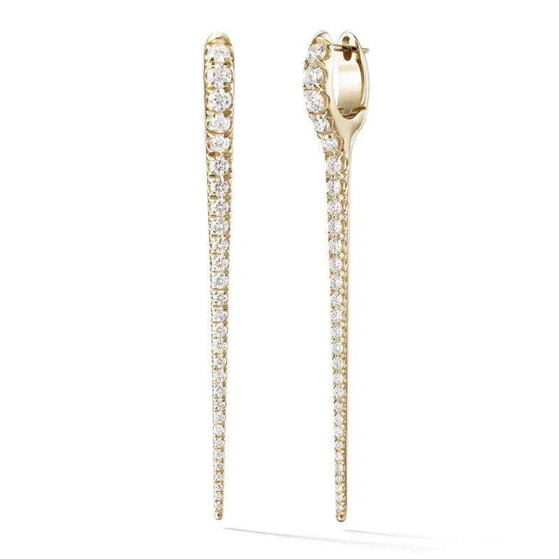 Gold earrings with diamond accents on a white background