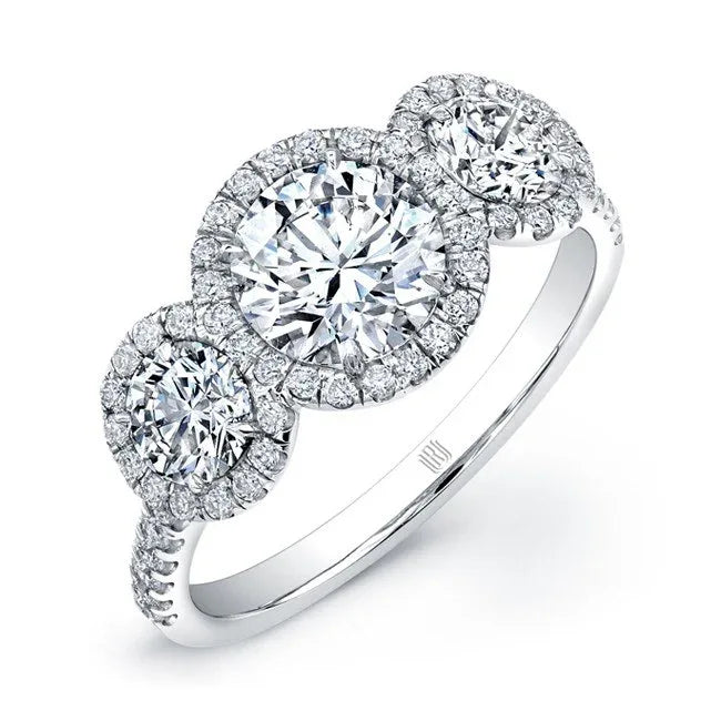 Person in a sweater sitting in an Adirondack chair drinking coffee with a beautiful silver colored ring on