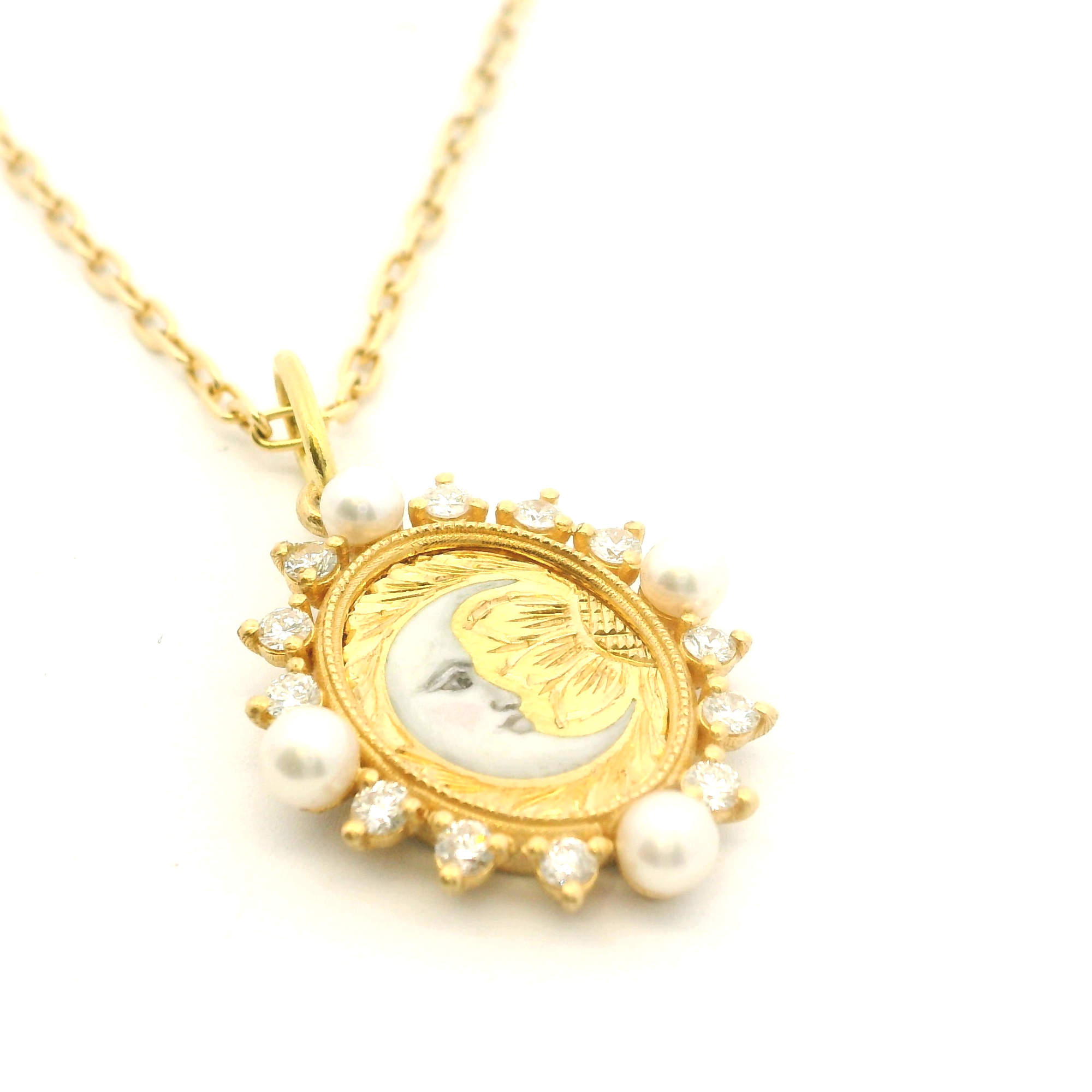 Golden pendant with pearls on a white background