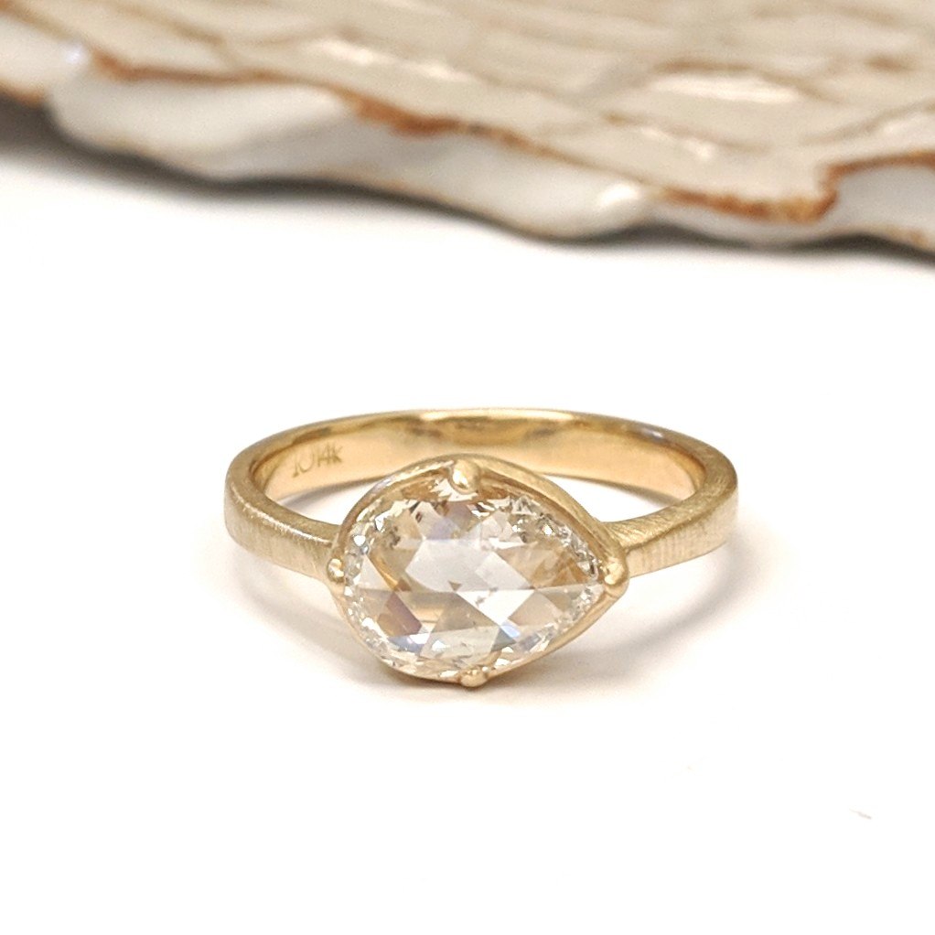 Yellow golden ring with a diamond