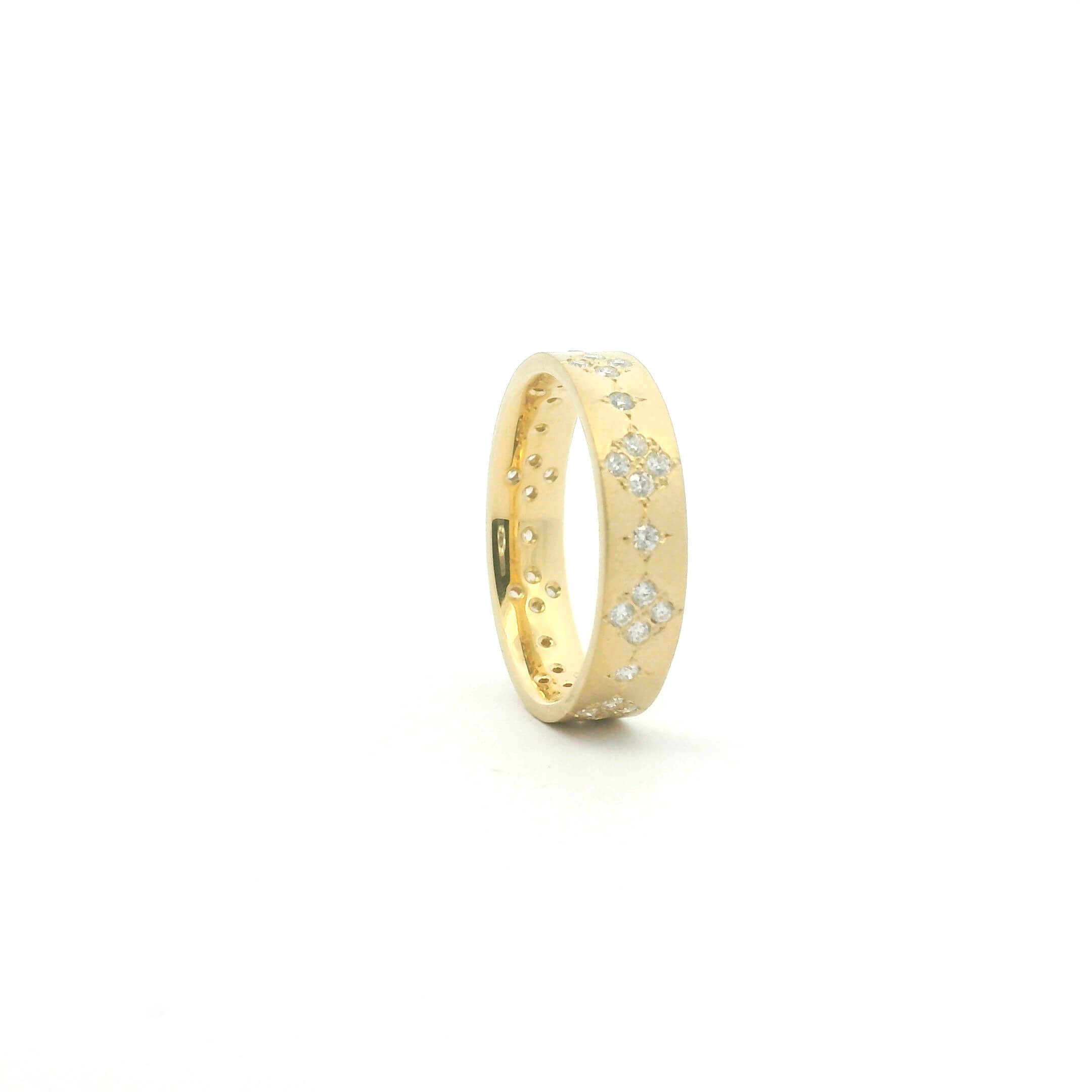 Stackable golden ring with multiple diamonds on white background