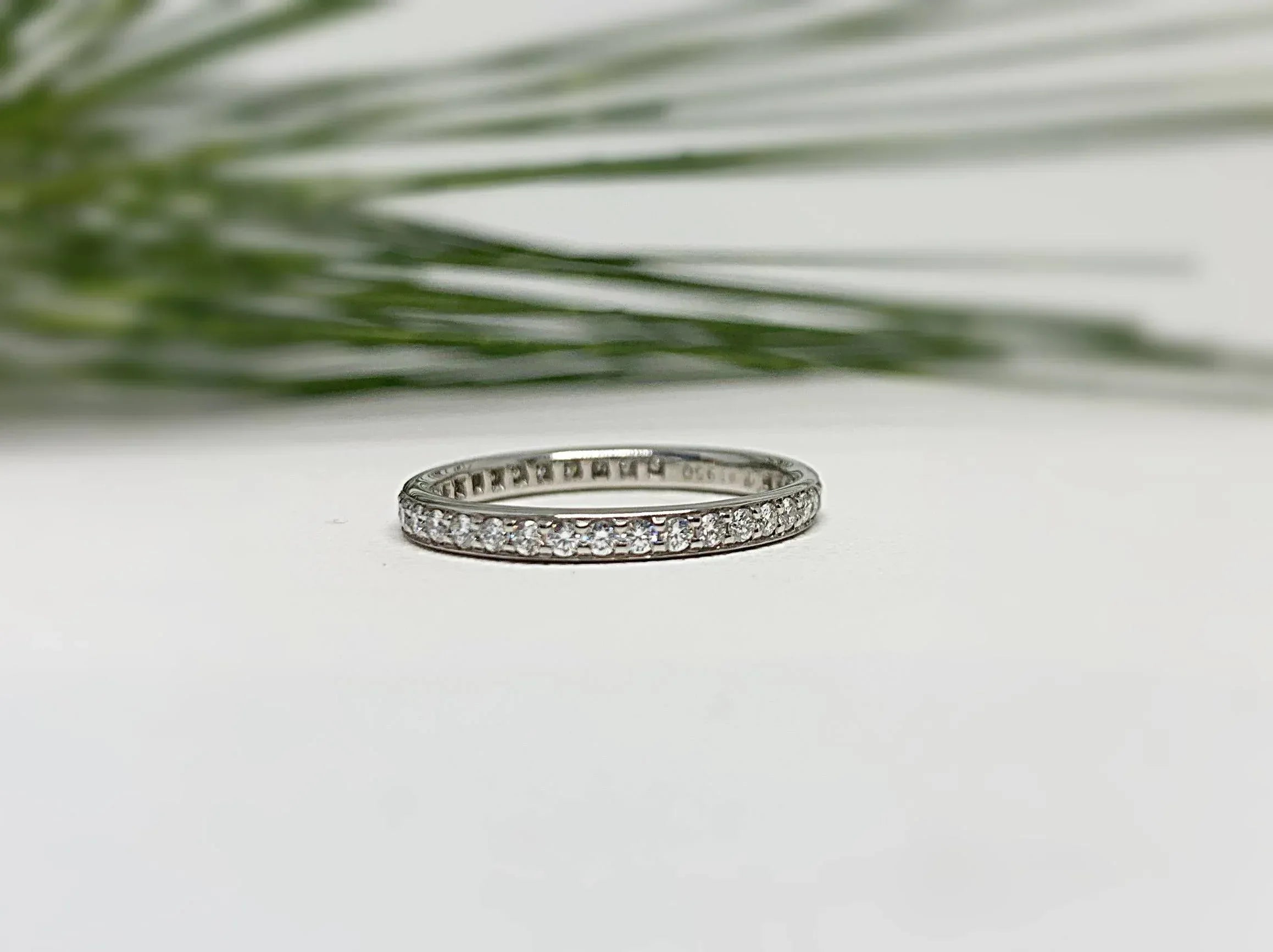 Wedding band with diamonds on an white background