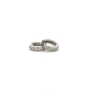 White Gold hoop earrings with diamonds embedded on a white background & surface