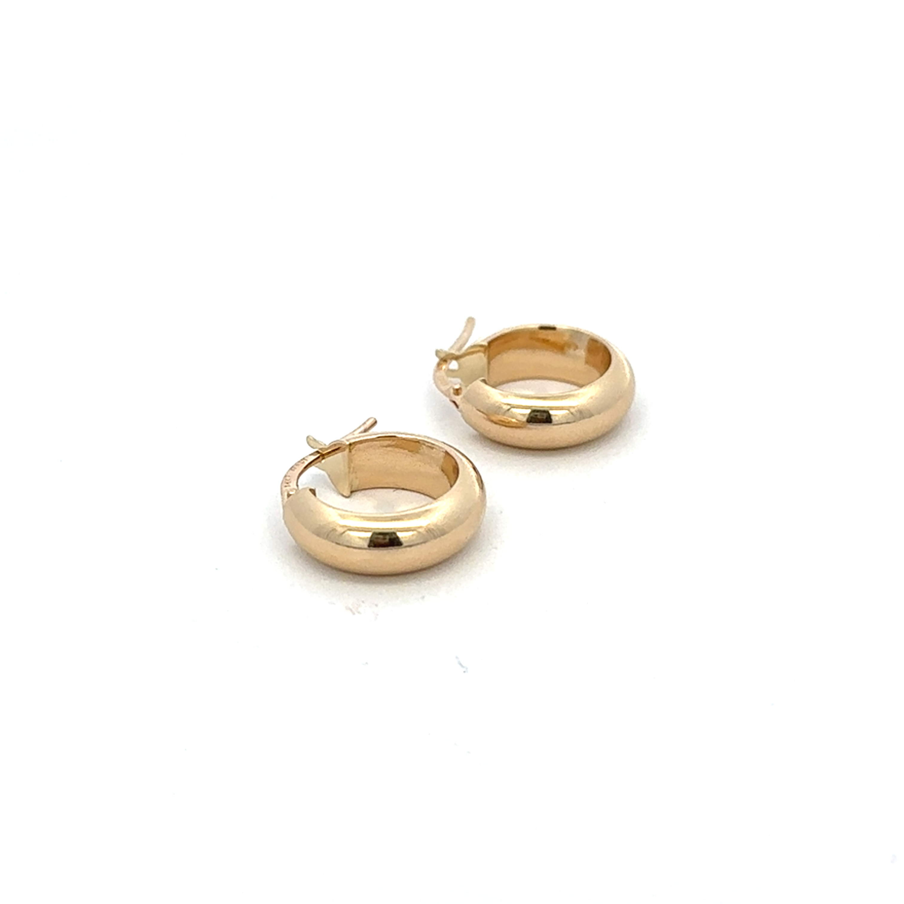 Gold hoop earrings on a white background