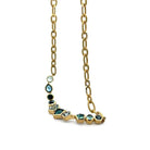 Gold necklace with green gemstones on a white background