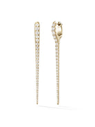 Gold earrings with diamond accents on a white background