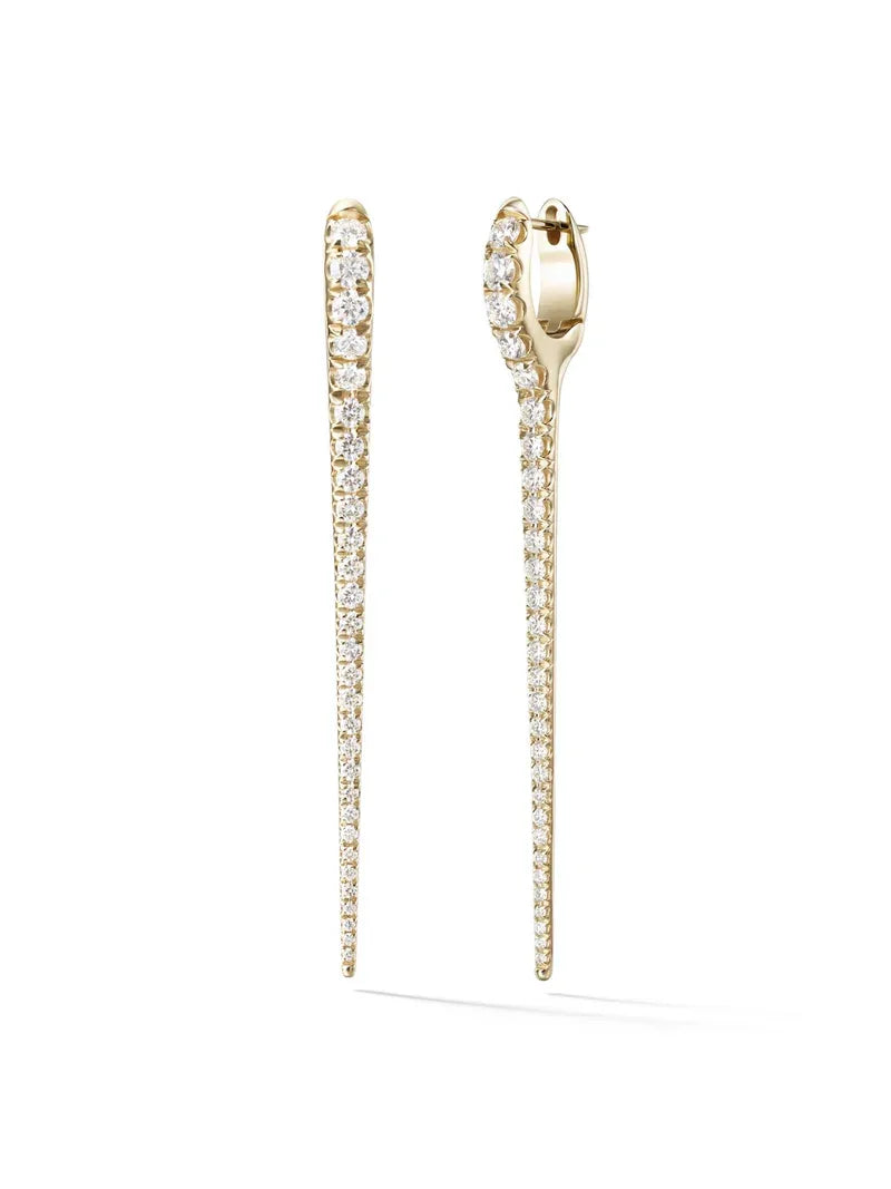 Gold earrings with diamond accents on a white background