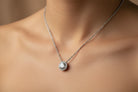 Diamond necklace on a wooden surface