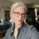 Person with gray hair wearing a dark jacket indoors - Ruthie Murray - Von Bargen's Jeweler