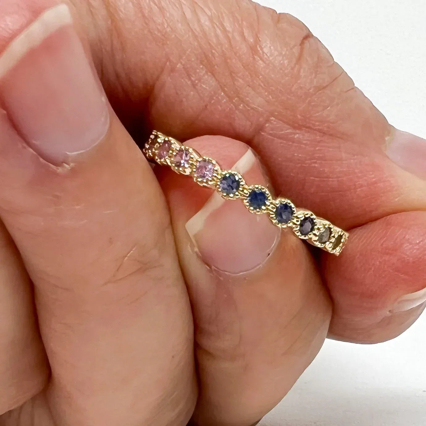 Yellow Gold and Rainbow Sapphire Bezel Band