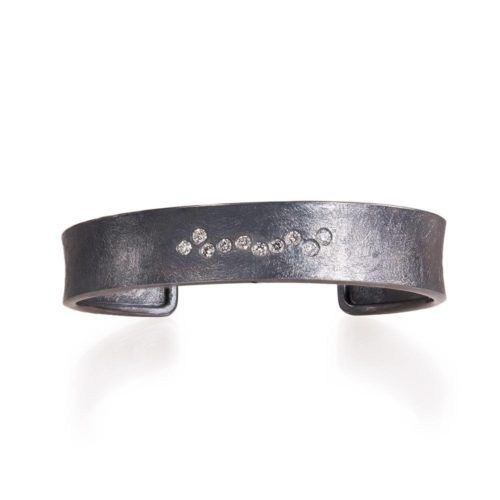 Hand forged oxidized sterling silver cuff with flush set diamonds