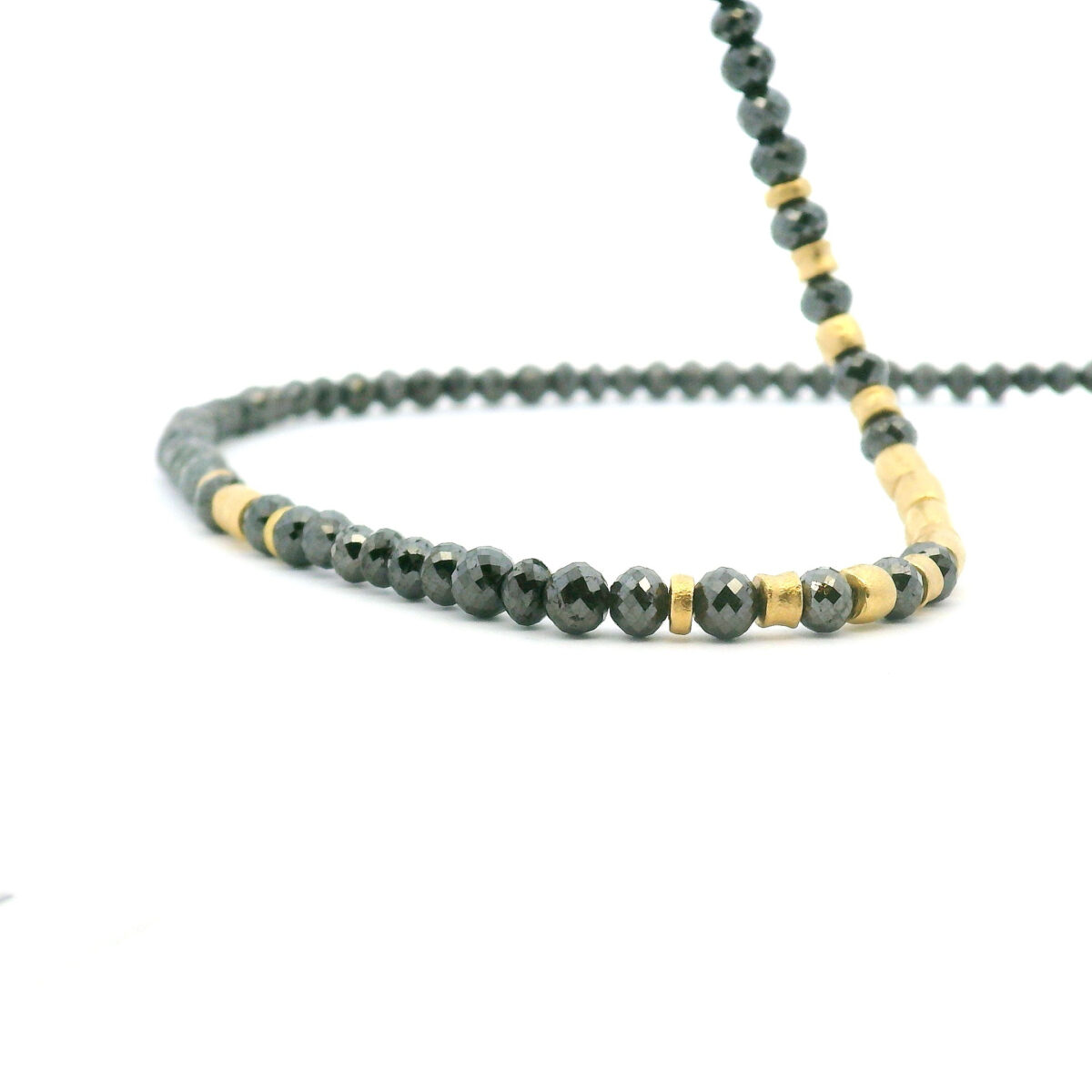 Faceted Black Diamond and gold strand