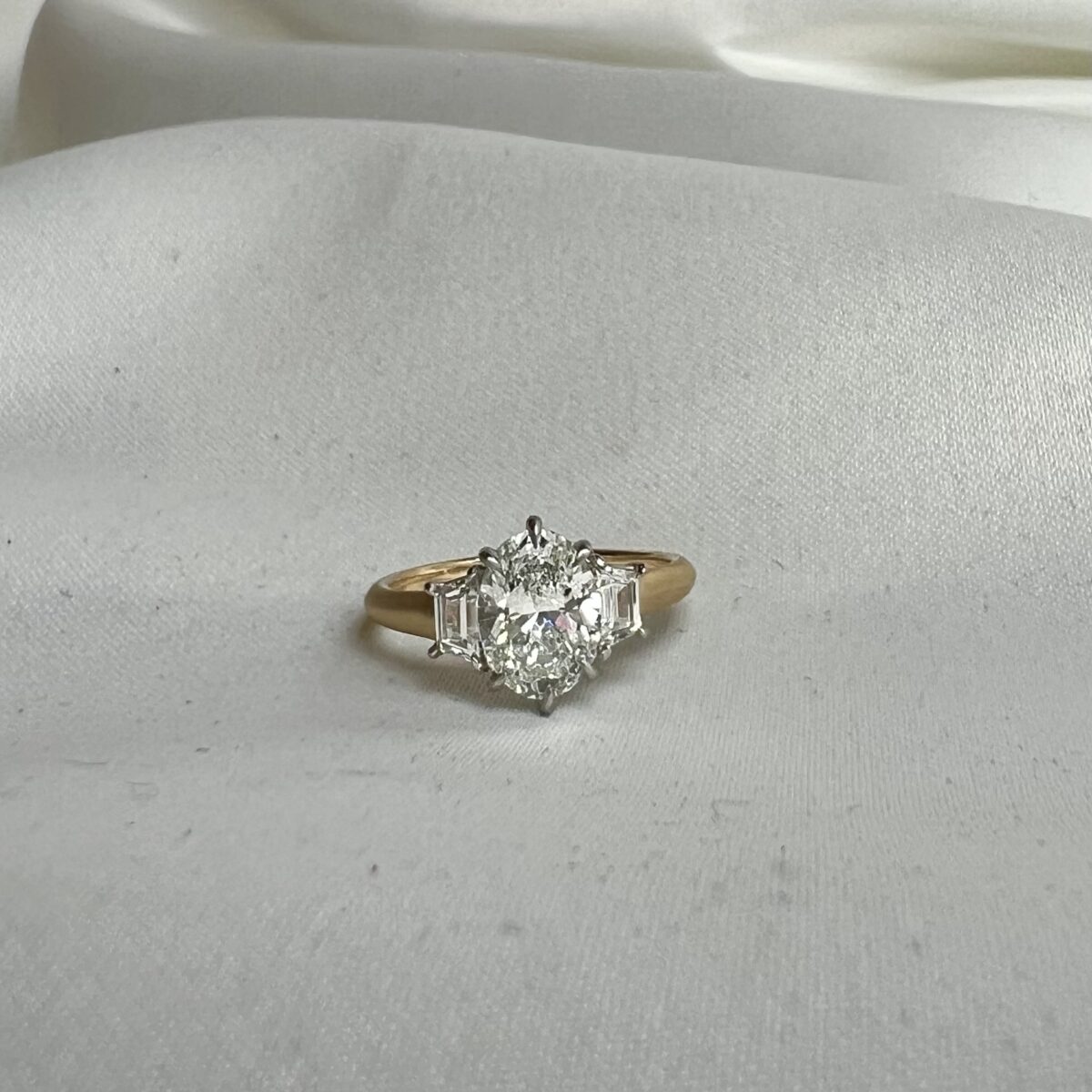 Yellow Gold and Oval Diamond Three Stone Ring